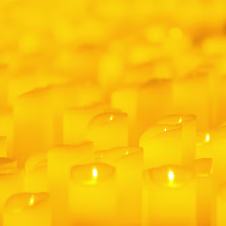 Rows of candles glowing at a Candlelight concert