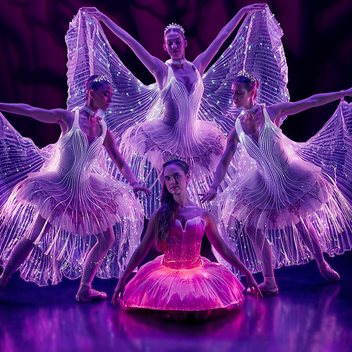 Ballet of Lights: Sleeping Beauty, dancers in illuminated winged costumes on a darkened stage